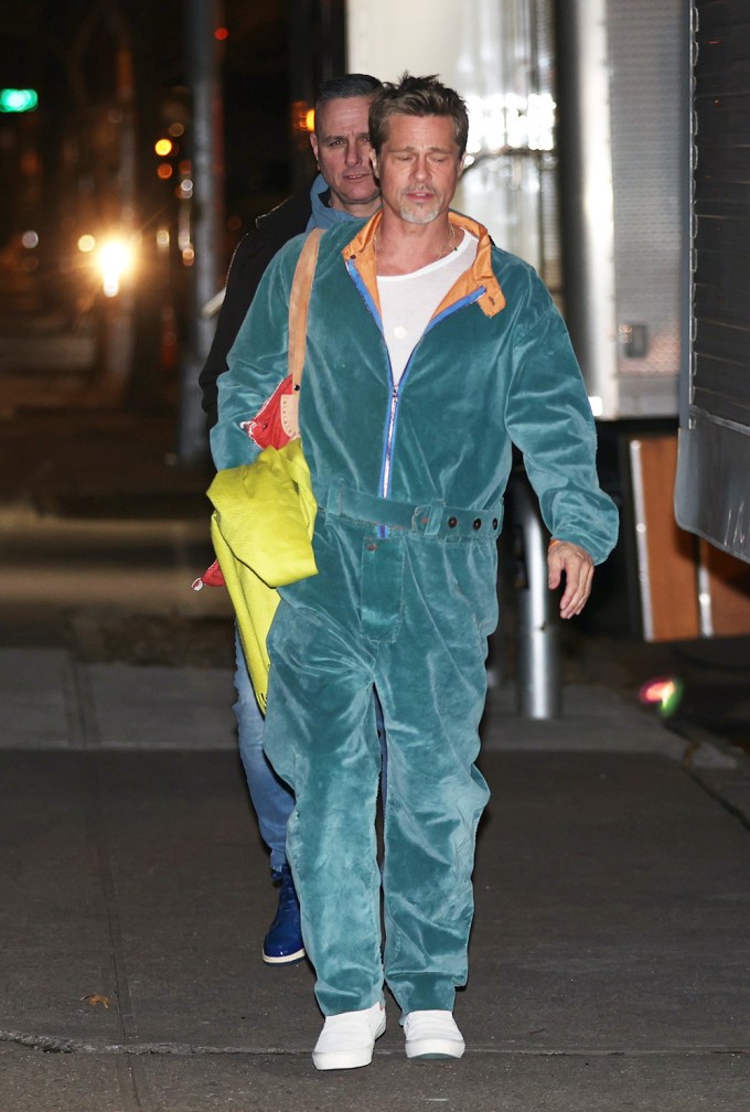 Brad Pitt wears a tracksuit filming a movie