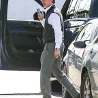 *EXCLUSIVE* Brad Pitt takes a call as he arrives on the set of 'Wolves' in LA