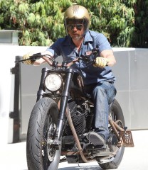 Brad Pitt
Brad Pitt Out and About on a Motorcycle in Los Angeles, America - 15 Jul 2009
Brad Pitt goes "Mechanic Style" one more time for a bike ride. Brad Pitt - aka Mr Jolie - cruising Hollywood's Sunset Boulevard on his custom, 'stripped-down' Harley Davidson, is a fairly common sight in Los Angeles. And he hardly tries to blend into the scenery unnoticed by wearing a bright gold crash helmet and tan leather gloves