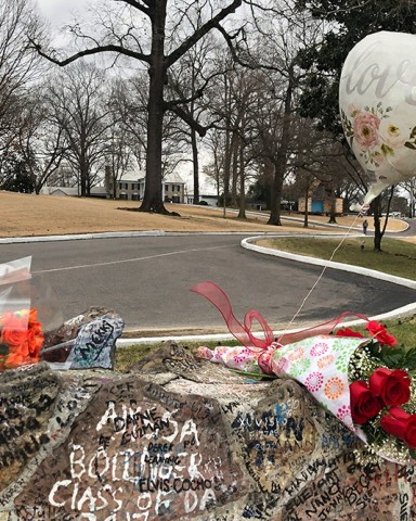 Bouquets of flowers and a balloon line the stone wall at Graceland, in Memphis, Tenn. Lisa Marie Presley will be buried at Graceland, her father Elvis' mansion that on Friday was a gathering place for fans who were distraught over the singer-songwriter's death a day earlier
Lisa Marie Presley Death, Memphis, United States - 13 Jan 2023