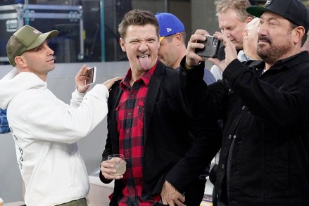 Actor Jeremy Renner, center, has fun during the first half of the NFC Championship NFL football game between the Los Angeles Rams and the San Francisco 49ers, in Inglewood, Calif 49ers Rams Football, Inglewood, USA - January 30, 2022