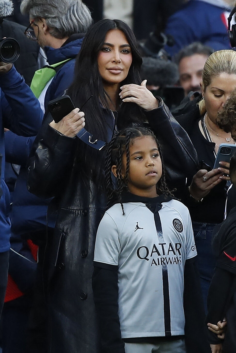 Kim Kardashian and Saint attend the Uber Eats Ligue 1 league match in Paris