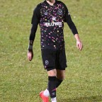 Romeo Beckham is seen making his debut for Brentford B's team against Erith & Belvedere's in Bexley whilst his proud father David Beckham watches from the sidelines and is mobbed by fans