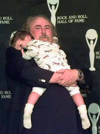CROSBY David Crosby holds his two-year-old son Jango in the wee hours of Wednesday morning, after he was inducted into the Rock and Roll Hall of Fame with Crosby Stills and Nash Tuesday in ClevelandROCK HALL INDUCTIONS, CLEVELAND, USA