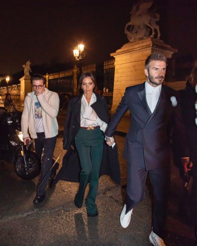David, Victoria and Brooklyn Beckham leaving the Dior Homme Menswear Fall/Winter 2020-2021 show as part of Paris Fashion Week on January 17, 2020 in Paris, France. 17 Jan 2020 Pictured: David, Victoria and Brooklyn Beckham. Photo credit: KCS Presse / MEGA TheMegaAgency.com +1 888 505 6342 (Mega Agency TagID: MEGA587497_002.jpg) [Photo via Mega Agency]