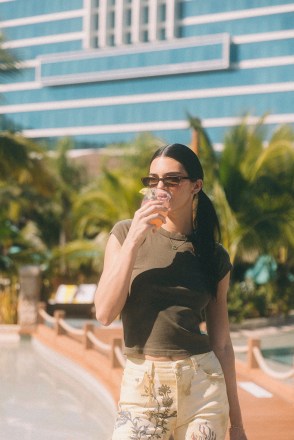 Kendall Jenner mixes 818 Tequila cocktails and signs bottles and a guitar at Seminole Hard Rock Hotel & Casino in Hollywood, Florida. The model and entrepreneur mixed Watermelon Margaritas around the pool with her 818 Tequila to help guests keep cool under the blazing sun. Kendall also treated herself to one of her favourite cocktails as she took a well-earned break from preparing drinks with a mixologist, posing for photos, signing 818 Tequila bottles for fans and autographing a trademark Hard Rock Hotel guitar. The 818 Tequila Watermelon Margarita cocktail is on the menu at the hotel’s Beach Club Bar & Grill to help beat the Florida heat. *BYLINE: Sophie Sahara/Mega. 07 Dec 2021 Pictured: Kendall Jenner enjoys an 818 Tequila Watermelon Margarita at Seminole Hard Rock Hotel & Casino in Hollywood, Florida. *BYLINE: Sophie Sahara/Mega. Photo credit: Sophie Sahara/Mega TheMegaAgency.com +1 888 505 6342 (Mega Agency TagID: MEGA811924_004.jpg) [Photo via Mega Agency]