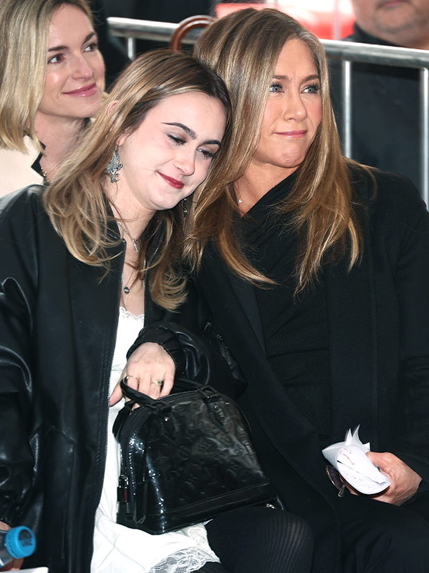 Coco Arquette and Jen Aniston lean on each other as they get emotional watching Courteney Cox be awared a star on the Hollywood Walk of Fame on Feb. 27, 2023 