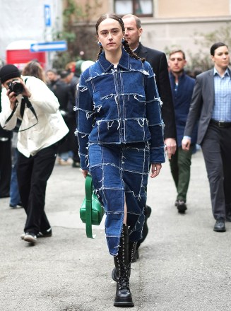 Model Ella Emhoff, Stepdaughter of US VP Kamala Harris, and In Denim Patch Jacket and Denim Patch Skirt and With Wednesday Addams Braids Attends Sunnei Fashion Show In Milan With Her Security Team. 24 Feb 2023 Pictured: Ella Emhoff. Photo credit: Tim Regas / MEGA TheMegaAgency.com +1 888 505 6342 (Mega Agency TagID: MEGA946938_001.jpg) [Photo via Mega Agency]