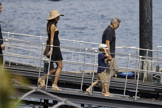 George Clooney & Amal Clooney, accompanied by their kids