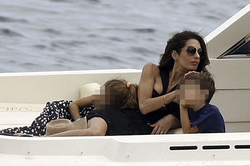 George Clooney and Amal Clooney, accompanied by their sleepy kids Ella and Alexander, embark on a picturesque boat trip in Como