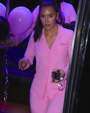 Kim Kardashian wears custom pink sleepwear outfit as she matches her daughter North and sister Kourtney as they celebrate on a party bus for her 10th birthday in Los Angeles. Kim was all smiles as she held onto multiple cell phones as they ended their night back at the Beverly Hills Hotel where they were treated to a villa for North and all of her friends. 14 Jun 2023 Pictured: North West, Kim Kardashian, Kourtney Kardashian. Photo credit: MEGA TheMegaAgency.com +1 888 505 6342 (Mega Agency TagID: MEGA995513_001.jpg) [Photo via Mega Agency]