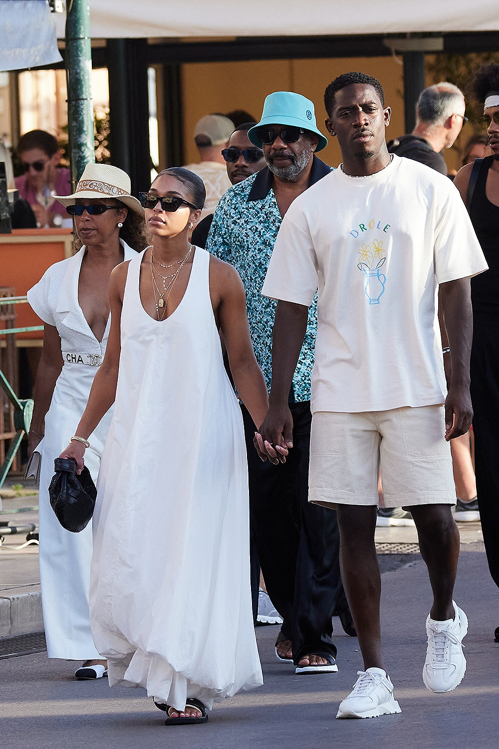 Saint-Tropez, FRANCE - Damson Idris, accompanied by his girlfriend Lori Harvey, joined by his mother Marjorie Bridges and brothers Wynton and Broderick Harvey Jr., enjoy a leisurely stroll through the charming streets of St. Tropez Pictured: Damson Idris, Lori Harvey, Marjorie Bridges, Steve Harvey +44 208 344 2007 / uksales@backgrid.com *UK Clients - Images containing children, please rasterize the face before posting*
