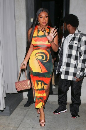 Beverly Hills, CA  - *EXCLUSIVE*  - Rapper Megan Thee Stallion shows off her curvy physique in a yellow/orange dress as she's seen leaving Asian fusion restaurant Crustacean's after celebrating her 28th birthday party with friends in Beverly Hills. Megan and her friends celebrated at the restaurant for 3 hours until leaving at around 12 midnight. Her friends were seen loading up Megan’s car with many high end gifts from Chanel to Louis Vuitton and so on.Pictured: Megan Thee StallionBACKGRID USA 16 FEBRUARY 2023 USA: +1 310 798 9111 / usasales@backgrid.comUK: +44 208 344 2007 / uksales@backgrid.com*UK Clients - Pictures Containing ChildrenPlease Pixelate Face Prior To Publication*