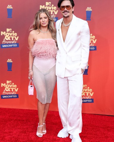 In this image released on June 5, American actress Ariana Madix and actor Tom Sandoval arrive at the 2022 MTV Movie And TV Awards: UNSCRIPTED held at The Barker Hangar in Santa Monica, Los Angeles, California, United States.
2022 MTV Movie And TV Awards: UNSCRIPTED, The Barker Hangar, Santa Monica, Los Angeles, California, United States - 06 Jun 2022