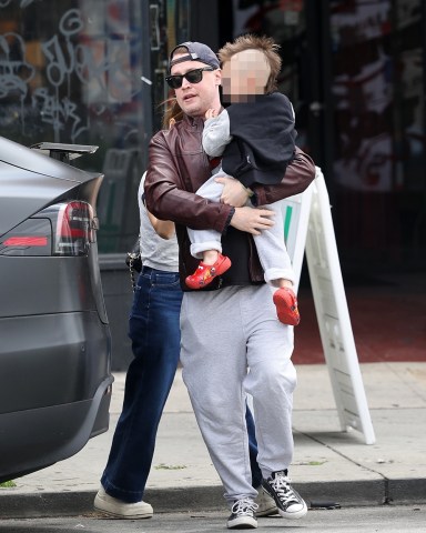 Los Angeles, CA  - *EXCLUSIVE*  - The family made an outing of Dakota’s new haircut, however their new baby must have been ‘home alone’ as it was not with the trio as they left ‘Manly and Sons barber shop’ in Silverlake, CA. Macauley wore a Ghostbusters movie tee as he carried out his son with his ‘Travis Bickle’ hair-do!Pictured: Macaulay Culkin, Brenda SongBACKGRID USA 1 MAY 2023 USA: +1 310 798 9111 / usasales@backgrid.comUK: +44 208 344 2007 / uksales@backgrid.com*UK Clients - Pictures Containing ChildrenPlease Pixelate Face Prior To Publication*