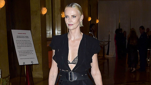 Charlize Theron Stuns In High Slit Dress Revealing Black Lacy Bra & Stockings On Oscars Weekend: Photos