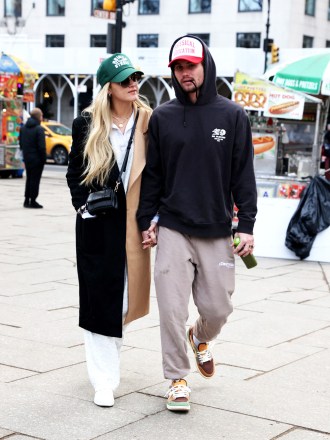 EXCLUSIVE: Kelsea Ballerini takes a romantic stroll in NYC with her new beau Chase Stokes ahead of her big Saturday Night Live gig. The ‘Kiss Somebody’ singer-songwriter’s relationship looks to be heating up with the Outer Banks star as they stepped out all smiles on Friday morning after enjoying the NY Rangers game together the previous night. The country cutie, 29, and actor, 30, had been captured smooching in the stands as they watched the home team take on the Ottawa Senators. On Friday, the duo kept a low profile and matched their styles in casual athletic wear and baseball hats. They held hands and linked arms, giggling as they crossed the road as they headed off to take in the sights of Central Park. Kelsea recently caused a stir after unfollowing her ex- husband Morgan Evans on Instagram. She and the Aussie singer were married for over five years but have endured a bitter recent split. 03 Mar 2023 Pictured: Kelsea Ballerini & Chase Stokes. Photo credit: Eric Kowalsky / MEGA TheMegaAgency.com +1 888 505 6342 (Mega Agency TagID: MEGA950614_003.jpg) [Photo via Mega Agency]
