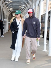 EXCLUSIVE: Kelsea Ballerini takes a romantic stroll in NYC with her new beau Chase Stokes ahead of her big Saturday Night Live gig. The ‘Kiss Somebody’ singer-songwriter’s relationship looks to be heating up with the Outer Banks star as they stepped out all smiles on Friday morning after enjoying the NY Rangers game together the previous night. The country cutie, 29, and actor, 30, had been captured smooching in the stands as they watched the home team take on the Ottawa Senators. On Friday, the duo kept a low profile and matched their styles in casual athletic wear and baseball hats. They held hands and linked arms, giggling as they crossed the road as they headed off to take in the sights of Central Park. Kelsea recently caused a stir after unfollowing her ex- husband Morgan Evans on Instagram. She and the Aussie singer were married for over five years but have endured a bitter recent split. 03 Mar 2023 Pictured: Kelsea Ballerini & Chase Stokes. Photo credit: Eric Kowalsky / MEGA TheMegaAgency.com +1 888 505 6342 (Mega Agency TagID: MEGA950614_013.jpg) [Photo via Mega Agency]
