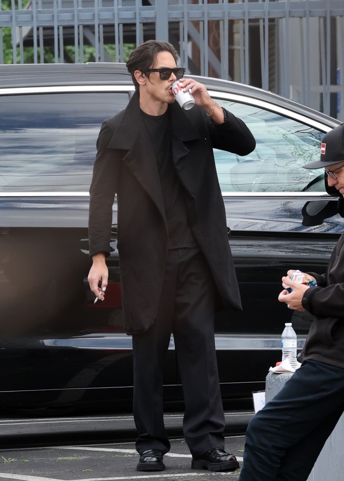 Tom Sandoval smokes a cigarette before filming a reunion