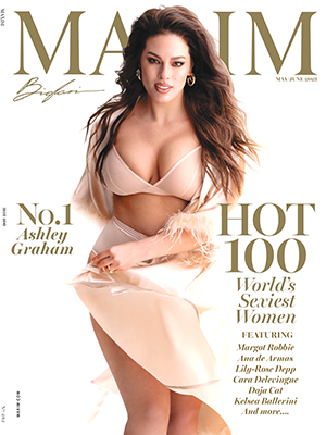 Ashley Graham covers her cleavage with a golden bust for lingerie