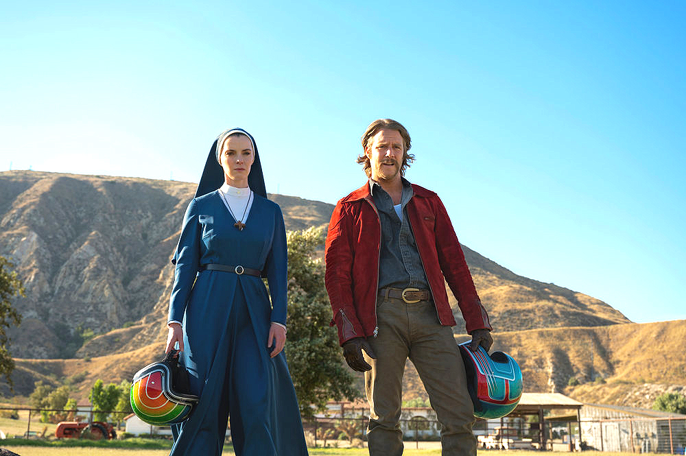 MRS. DAVIS -- "Mother of Mercy: The Call of the Horse" Episode 101 -- Pictured: (l-r) Betty Gilpin as Simone, Jake McDorman as Wiley -- (Photo by: Colleen Hayes/Peacock)