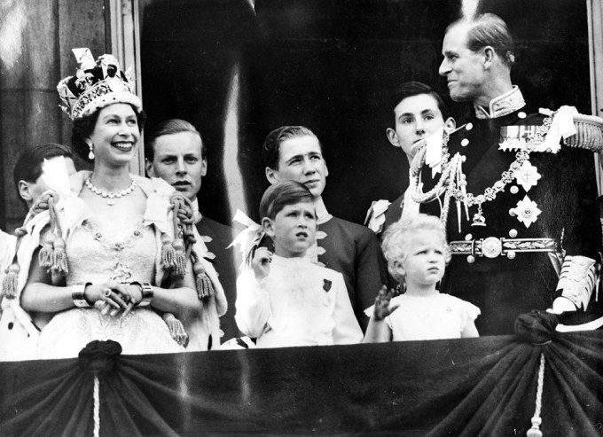 Queen Elizabeth Smiles With Prince Philip, Prince Charles, & Princess Anne