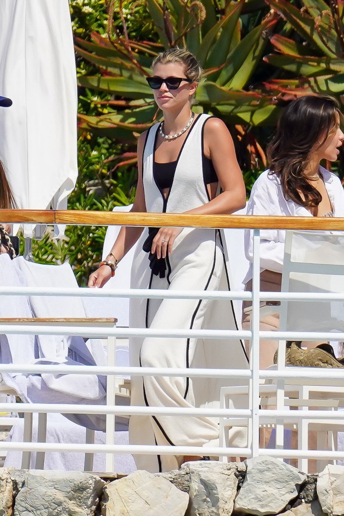 Sofia Richie in a white cover-up