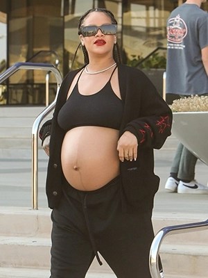 Rihanna gives peek at baby bump in a cozy leopard zip-up and black