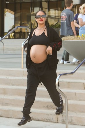 West Hollywood, CA - *EXCLUSIVE* - A heavily pregnant Rihanna was spotted leaving the Pacific Design Center in West Hollywood exposing her big baby bump. Pictured: Rihanna BACKGRID USA 7 JULY 2023 USA: +1 310 798 9111 / usasales@backgrid.com UK: +44 208 344 2007 / uksales@backgrid.com *UK Customers - Photos containing children, please rasterize face before posting*