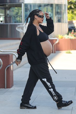 West Hollywood, CA - *EXCLUSIVE* - A heavily pregnant Rihanna was spotted leaving the Pacific Design Center in West Hollywood exposing her big baby bump. Pictured: Rihanna BACKGRID USA 8 JULY 2023 USA: +1 310 798 9111 / usasales@backgrid.com UK: +44 208 344 2007 / uksales@backgrid.com *UK Customers - Images containing children, please rasterize face before posting*