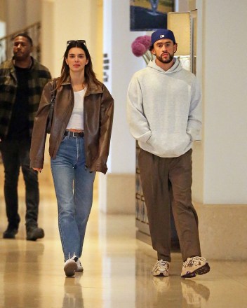 EXCLUSIVE: New couple Kendall Jenner and Bad Bunny step out for a casual brunch in Beverly Hills. The duo went low key for the outing, with the 27-year-old supermodel sporting jeans and sneakers and her rapper beau in a baseball hat and hoodie. Kendall ended her two-year romance with NBA star Devin Booker last November and has been dating the Puerto Rican musician - real name is Benito Antonio Martínez- for the last four months. At one point the reality TV star appeared shy, appearing to hide her face from cameras. 08 Jun 2023 Pictured: Kendall Jenner, Bad Bunny. Photo credit: Thecelebrityfinder/MEGA TheMegaAgency.com +1 888 505 6342 (Mega Agency TagID: MEGA992617_006.jpg) [Photo via Mega Agency]