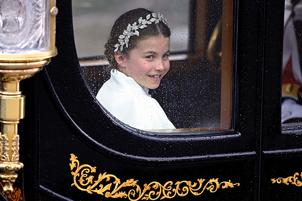 Princess Charlotte smiles from her carriage at King Charles' coronation on May 6, 2023 (Photo: David Fisher/Shutterstock)