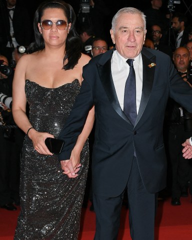 Martin Scorsese and Robert De Niro depart the "Killers Of The Flower Moon" red carpet during the 76th annual Cannes film festival. 20 May 2023 Pictured: Martin Scorsese Robert De Niro and Tiffany Chen. Photo credit: KCS Presse / MEGA TheMegaAgency.com +1 888 505 6342 (Mega Agency TagID: MEGA984533_046.jpg) [Photo via Mega Agency]