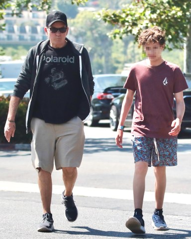 Malibu, CA  - *EXCLUSIVE*  - Charlie Sheen shopping with his twin son at a surf store and enjoying lunch together at Subway in Malibu.Pictured: Charlie SheenBACKGRID USA 25 JULY 2023 BYLINE MUST READ: @MALIBUUSTARS YOUTUBE / BACKGRIDUSA: +1 310 798 9111 / usasales@backgrid.comUK: +44 208 344 2007 / uksales@backgrid.com*UK Clients - Pictures Containing ChildrenPlease Pixelate Face Prior To Publication*