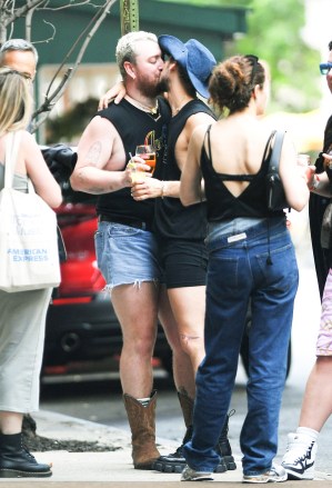 New York, NY  - *EXCLUSIVE*  - English singer Sam Smith PDA with boyfriend Christian Cowan in Soho, as he waits for Kim Petras during pride march in New York.Pictured: Sam Smith, Christian Cowan, Kim PetrasBACKGRID USA 26 JUNE 2023 BYLINE MUST READ: JosiahW / BACKGRIDUSA: +1 310 798 9111 / usasales@backgrid.comUK: +44 208 344 2007 / uksales@backgrid.com*UK Clients - Pictures Containing ChildrenPlease Pixelate Face Prior To Publication*