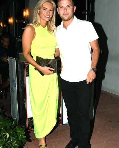 EXCLUSIVE: Chase Chrisley and fiancé Emmy Medders are seen leaving trendy upscale eatery Papi Steak after having dinner in Miami. The couple seems in good spirits as they laughed and kissed before taking off in red Rolls Royce. 24 Feb 2023 Pictured: Chase Chrisley; Emmy Medders. Photo credit: MEGA TheMegaAgency.com +1 888 505 6342 (Mega Agency TagID: MEGA947130_008.jpg) [Photo via Mega Agency]