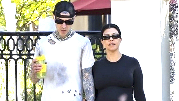Pregnant Kourtney Kardashian leaves her jeans unbuttoned for a morning walk with Travis Barker