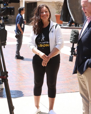 Fran Drescher President of the SAG-AFTRA seen after announcing to forge ahead in the strike after holding firm to negotiations. 13 Jul 2023 Pictured: Fran Drescher. Photo credit: APEX / MEGA TheMegaAgency.com +1 888 505 6342 (Mega Agency TagID: MEGA1007045_012.jpg) [Photo via Mega Agency]