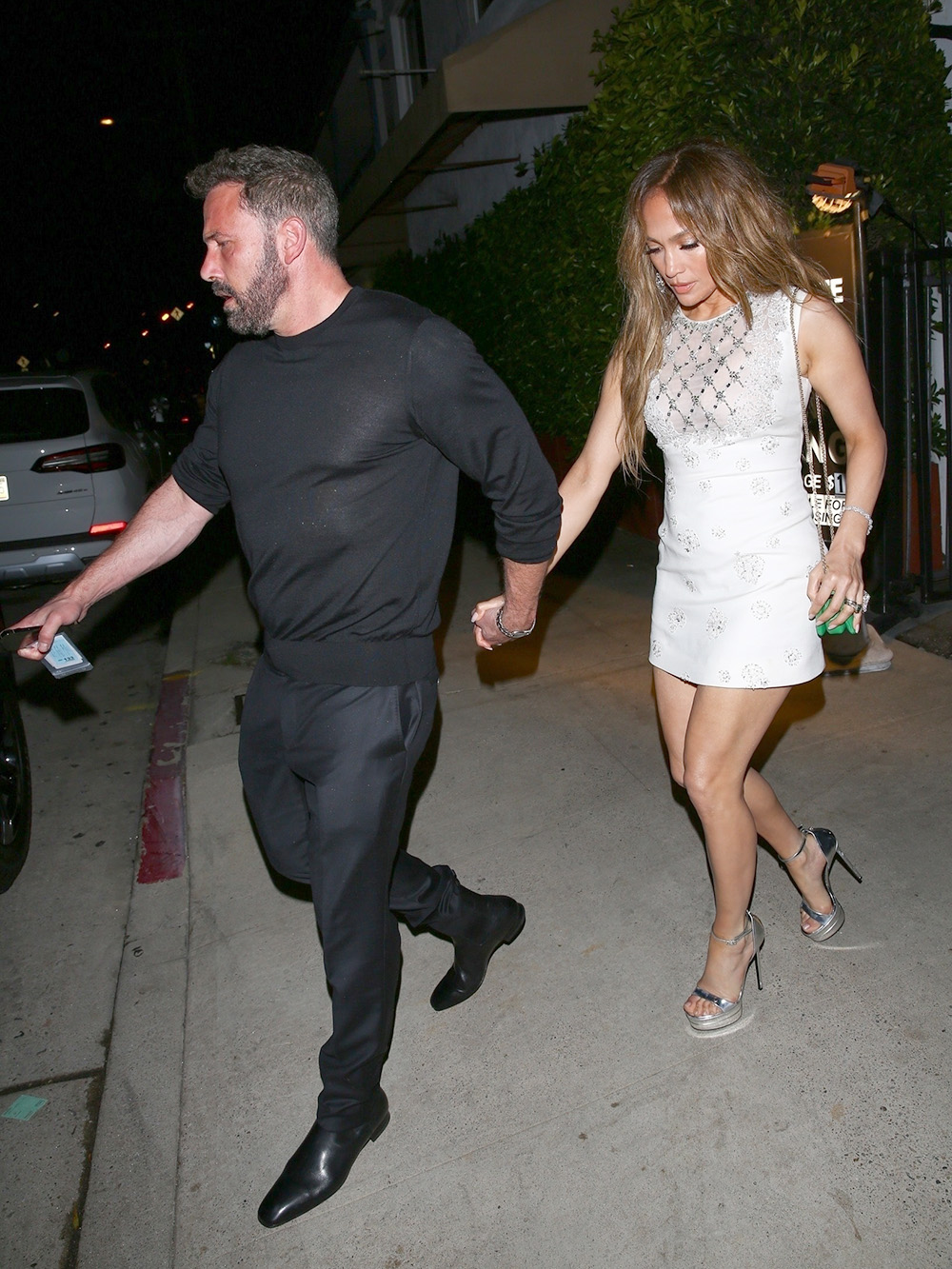 Santa Monica, CA - *EXCLUSIVE* - Jennifer Lopez and Ben Affleck's Wedding Anniversary Celebrated with a Romantic Dinner in Santa Monica. The waiter brought a cake with a candle to the table for the wedding anniversary celebration. Leaving the restaurant Ben Affleck couldn't open his new Rivian electric car for Jennifer to get in and it took about 1 minute for him to open the car. Pictured: Jennifer Lopez, Ben Affleck BACKGRID USA 16 JULY 2023 BYLINE MUST READ: The Hollywood JR / BACKGRID USA: +1 310 798 9111 / usasales@backgrid.com UK: +44 208 344 2007 / uksales@backgrid.com *UK Clients - Pictures Containing Children
Please Pixelate Face Prior To Publication*