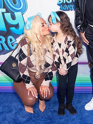 Coco Austin Kisses Daughter Chanel in Matching Floral Dresses