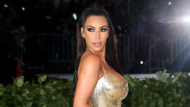 Kim Kardashian Shimmers In Gold Bikini For ‘Night Swim In Puglia’: Photos