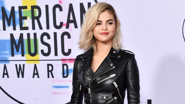 Selena Gomez Stuns In Leather Mini Skirt As She Cozies Up To Some Friends In New Photo
