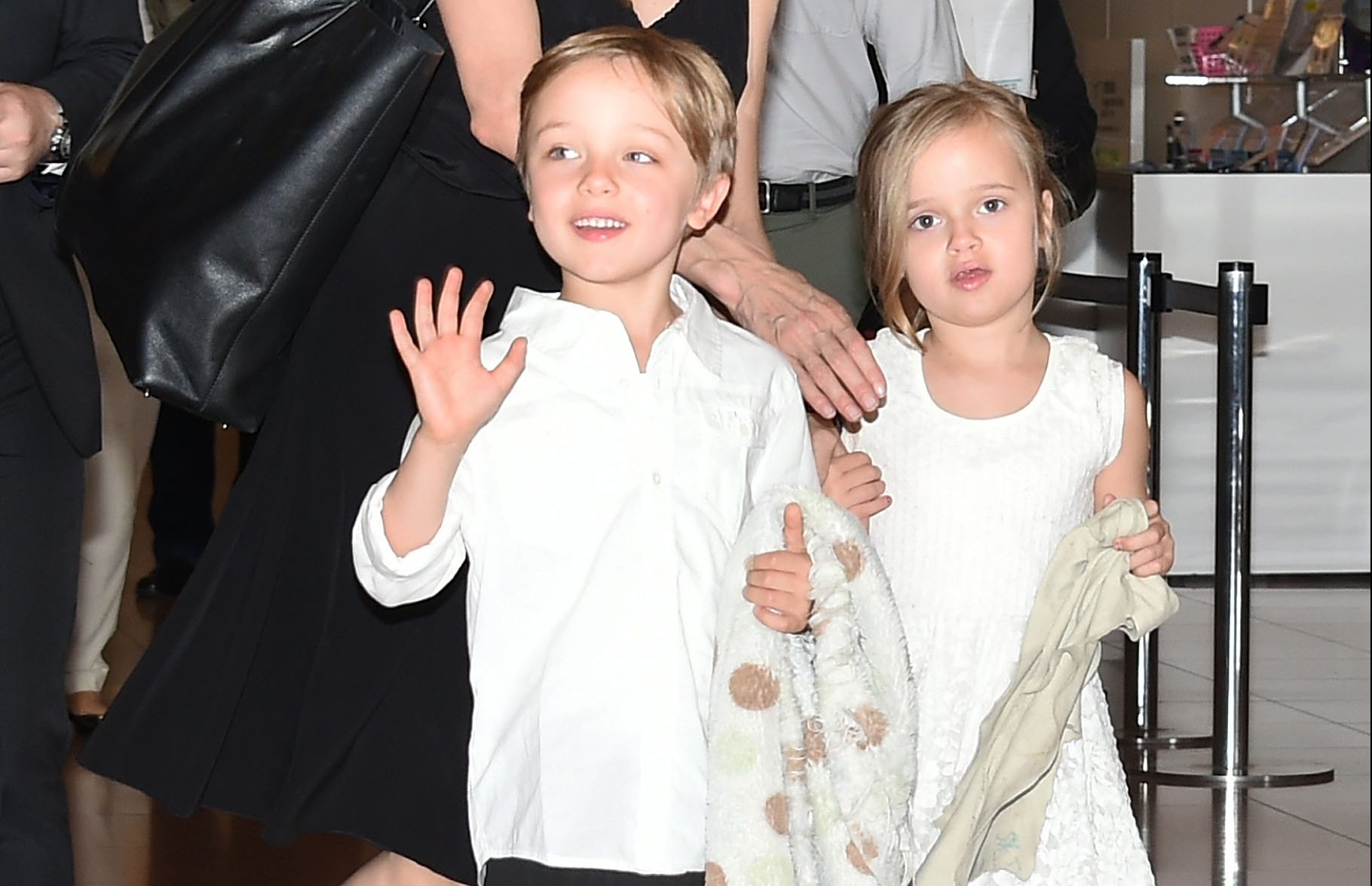 TOKYO, JAPAN - JUNE 21:  Knox Jolie-Pitt, Angelina Jolie and Vivienne Jolie-Pitt are seen upon arrival at Haneda Airport on June 21, 2014 in Tokyo, Japan. (Photo by Jun Sato/GC Images)