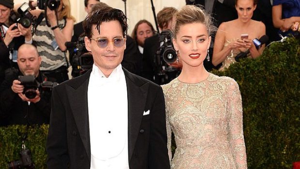 NEW YORK, NY - MAY 05: Johnny Depp and Amber Heard attend the "Charles James: Beyond Fashion" Costume Institute Gala at the Metropolitan Museum of Art on May 5, 2014 in New York City. (Photo by Jamie McCarthy/FilmMagic)