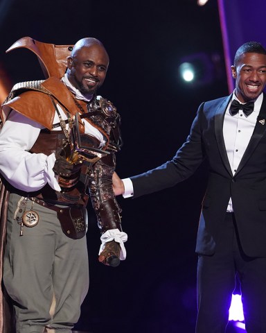 THE MASKED SINGER: Wayne Brady and host Nick Cannon in the “Road to the Finals / Season Finale: And The Winner Takes It All and Takes It Off” two-hour season finale episode of THE MASKED SINGER airing Wednesday, Dec. 18 (8:00-10:00 PM ET/PT) on FOX. CR: Lisa Rose / FOX ©2020 FOX MEDIA LLC.