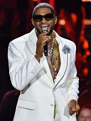 Usher performing on stage in Paris