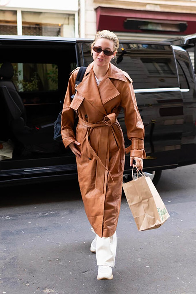 Lili Reinhart Wears Karen Millen Leather Oversize Trench Coat in Paris Fashion Week