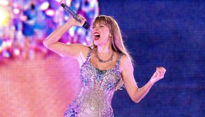 Taylor Swift singing at one of her Eras Tour concerts in 2023