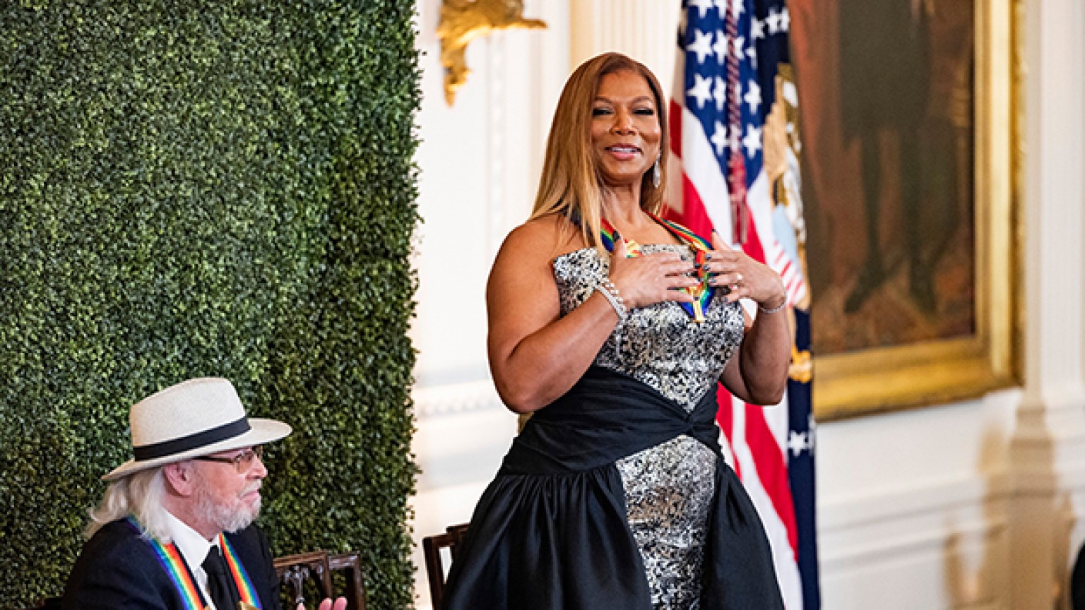 Queen Latifah dazzles in a royal black and silver metallic dress at the