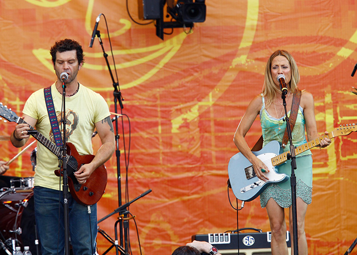 Doyle Bramhall II and Sheryl Crow performing on stage